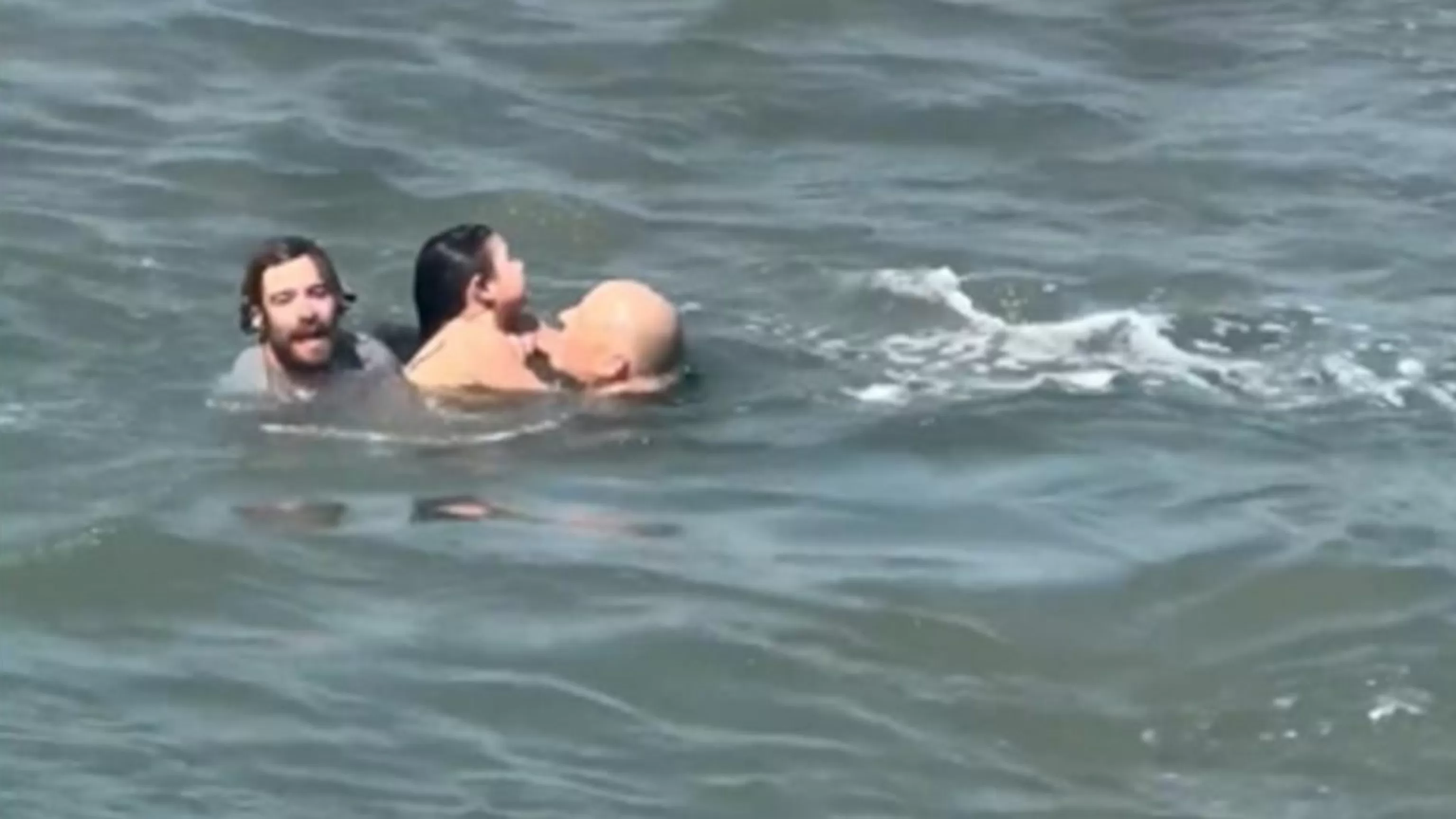 WATCH: Surfing coach rescues dad, daughter from rip current
