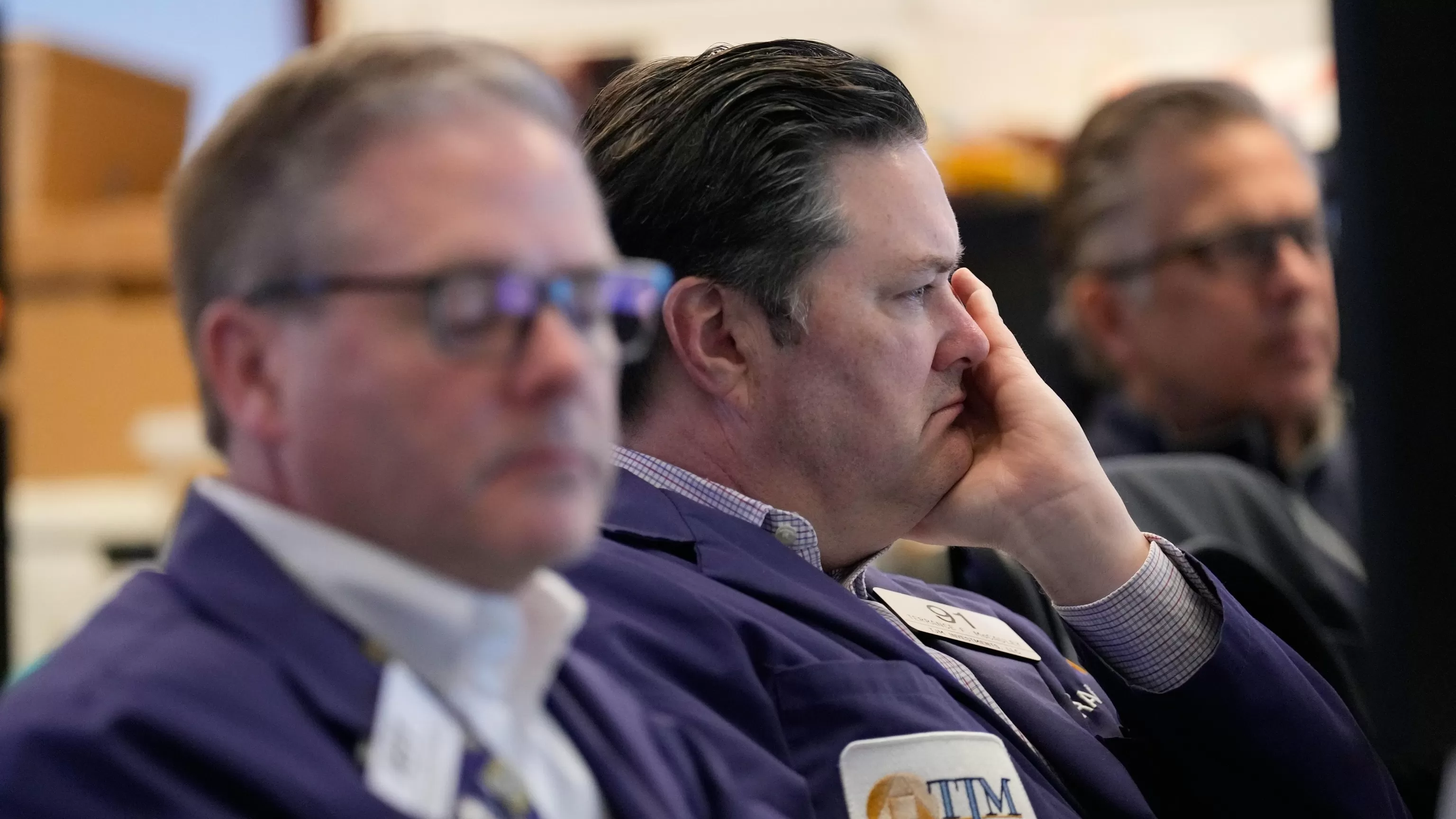 Wall Street slides, oil prices again over $100 a barrel as US and Iran trade threats over ports