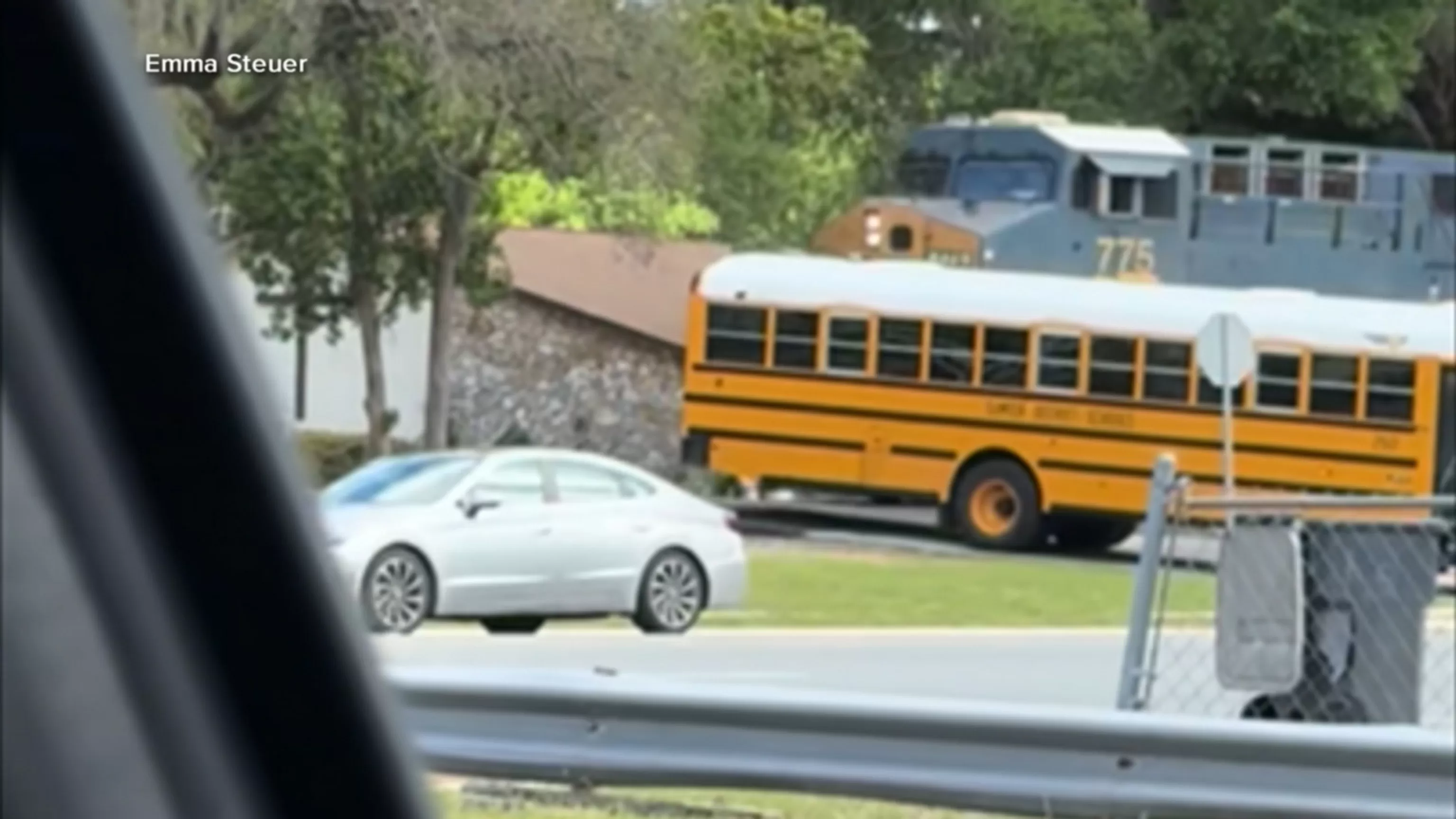 WATCH: School bus driver arrested after driving bus onto train tracks