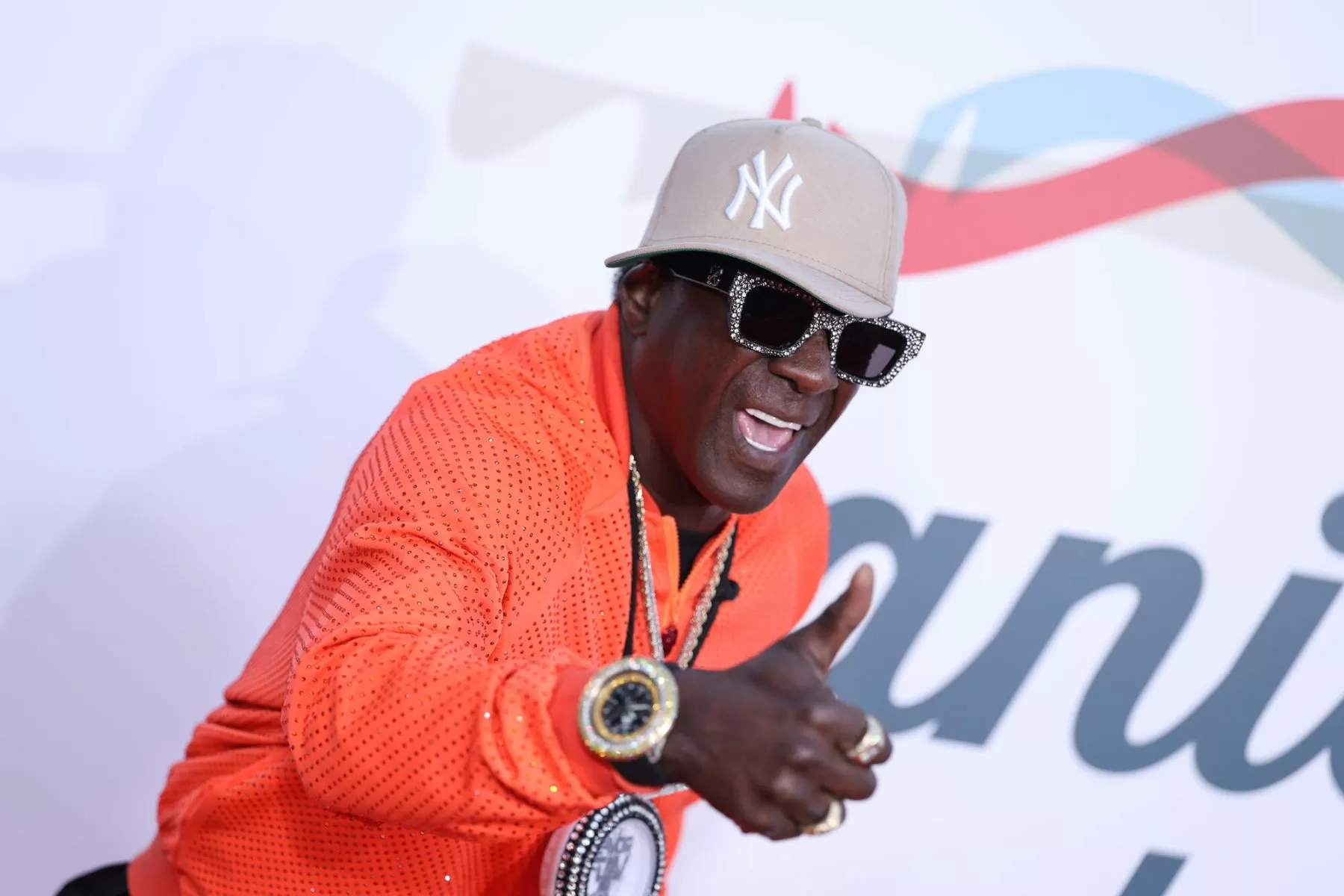 Watch ‘Champion of All Athletes’ Flavor Flav Throw the First Pitch at Fenway Park on Easter