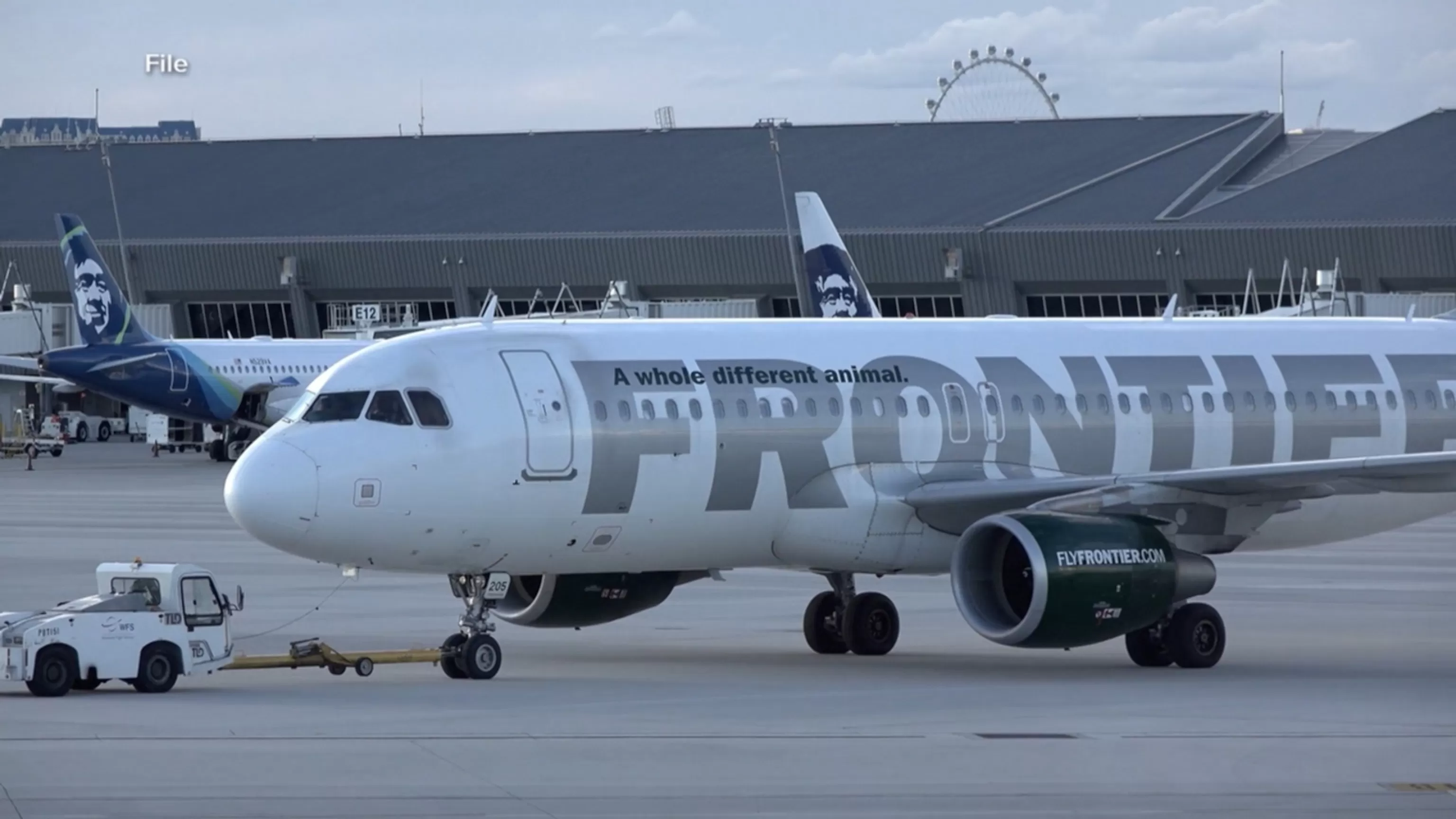 WATCH: Close call between passenger jet, 2 trucks on tarmac at LAX